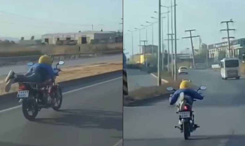 Motosikleti yatarak kullandı, yürekli ağza getirdi